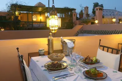 a table with two plates of food on it at Riad Zineb in Marrakech