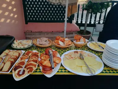 a table with plates of food on top at Riad Zineb in Marrakech