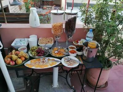 a table filled with plates of food on a table at Riad Zineb in Marrakech