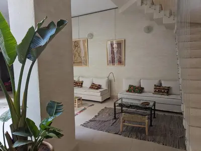 a living room with a couch and a table at Dar d'Art in Marrakech