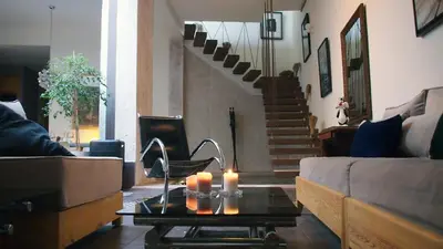 a living room with a couch and candles on a table at Dar d'Art in Marrakech
