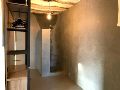 a hallway with a staircase and a wall at Palais Souad in Marrakech