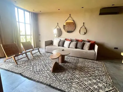 a living room with a couch and a table at Palais Souad in Marrakech