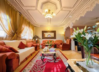 a living room with a couch and a table at Oranger Family House Marrakech City Center in Marrakech