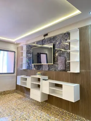 a bathroom with a mirror on a wall at Villa des Roses Privée in Marrakech