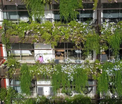a building with a lot of plants on it at M Appart in Marrakech