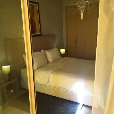 a mirror reflection of a bed in a bedroom at prestigia in Marrakech