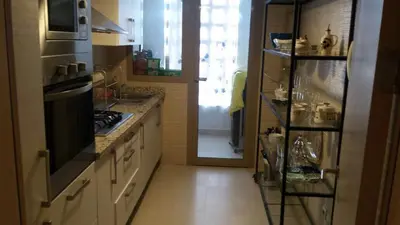 a kitchen with a sink and a stove top oven at prestigia in Marrakech