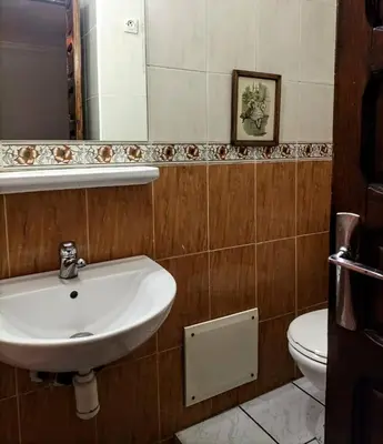 a bathroom with a sink and a toilet at Riad familiale à Marrakech in Marrakech