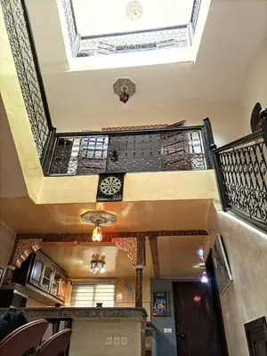 an empty room with a ceiling and a staircase at Riad familiale à Marrakech in Marrakech
