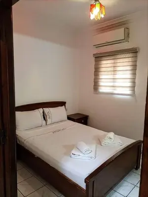 a bedroom with a bed with two towels on it at Riad familiale à Marrakech in Marrakech