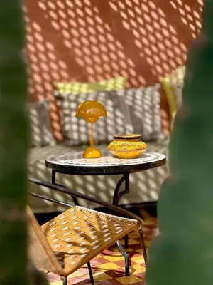 a table with a plate with a mushroom on it at Vibrant Medina Loft and Roof Top in Marrakech