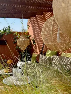 a view of a garden with grass and plants at Vibrant Medina Loft and Roof Top in Marrakech