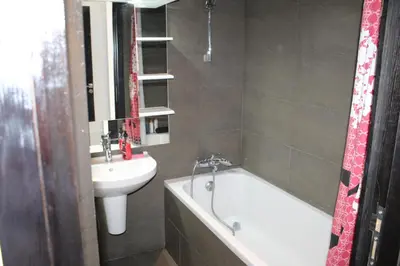 a bathroom with a sink and a bath tub next to a sink at La Fontaine in Marrakech