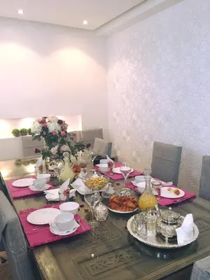 a table with plates of food on top at Riad Tsar Mimoun in Marrakech