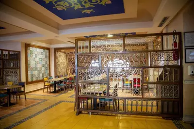 a room with a rack of wine glasses at Rose Aqua Park Hotel in Marrakech