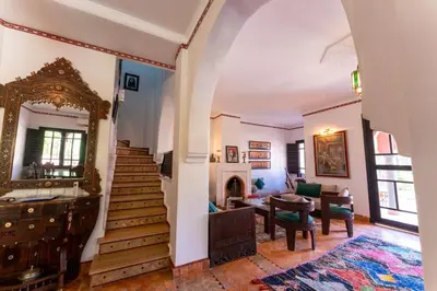 a room with a staircase and a living room at Maison Ayda in Marrakech