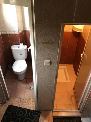a bathroom with a toilet and a shower stall at Hotel Medina in Marrakech