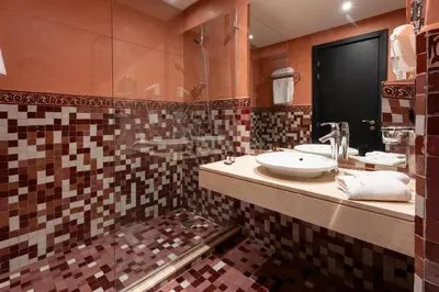 a bathroom with a sink and a mirror at Zephyr Targa Marrakech in Marrakech