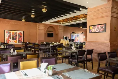 a dining room filled with tables and chairs at Zephyr Targa Marrakech in Marrakech