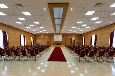 an empty hall with chairs and a red carpet at Zephyr Targa Marrakech in Marrakech