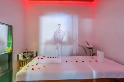 a room with a cake on a bed with roses on it at Riad la villa bleue & SPA in Marrakech