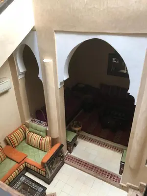 an overhead view of a living room with a couch at Riad Côté palmeraie in Marrakech