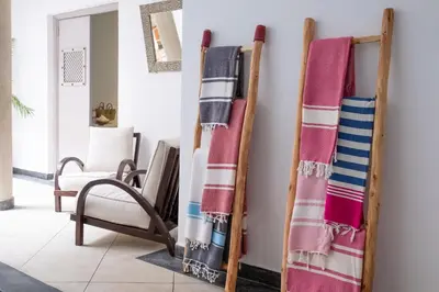 a group of towels hanging on a wall at Riad Bibazia in Marrakech