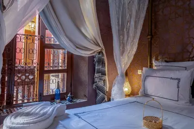 a bedroom with a bed and a window at Riad Rêves D'orient & Spa in Marrakech