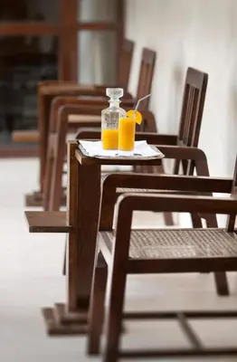 a table with two glasses of orange juice on it at Villa Makassar in Marrakech