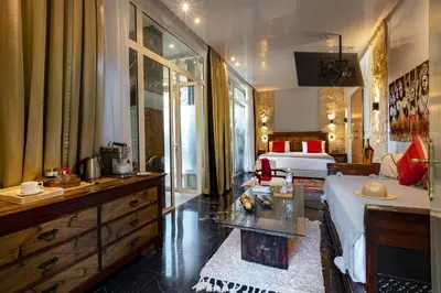 a large hotel room with a bed and a bedroom at Palais Mirage d'Atlas, Hôtel & Spa in Marrakech