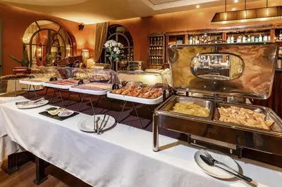 a buffet with several trays of food on display at Palais Mirage d'Atlas, Hôtel & Spa in Marrakech
