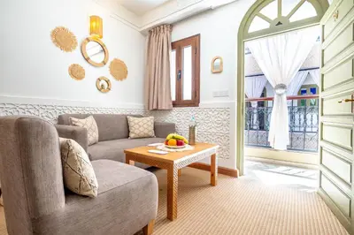 a living room with a couch and a table at Riad Hamdane Rooftop & SPA in Marrakech