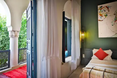 a bedroom with a bed and a window at Hotel & Spa Dar Sara in Marrakech