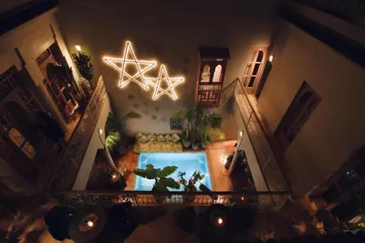 an overhead view of a living room with a aquarium at Riad 117 in Marrakech