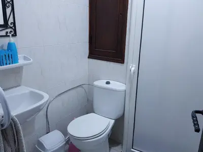 a bathroom with a toilet and a sink and a shower at Riad Assia in Marrakech
