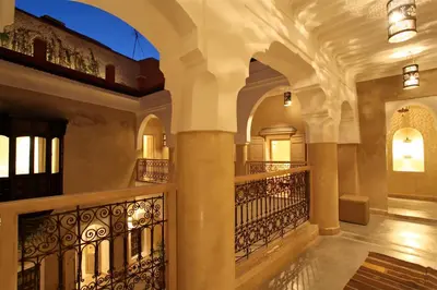 an indoor hallway of a building with a balcony at Riad Dar Ten in Marrakech