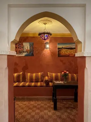 a living room with a couch and a table at Riad Mboja Chez Ali Baba in Marrakech