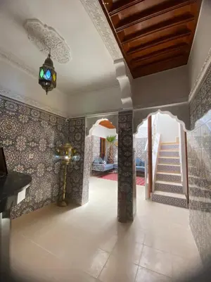 a hallway with a staircase in a house at Dar Dikrayat in Marrakech