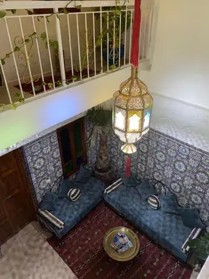 an overhead view of a room with a table and a chandelier at Dar Dikrayat in Marrakech