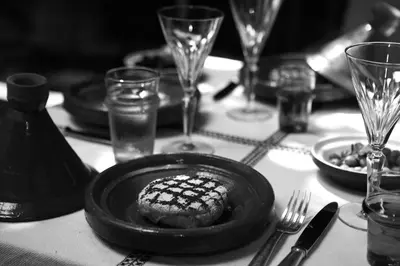 a table with a plate of food on a table at Riad Malika in Marrakech