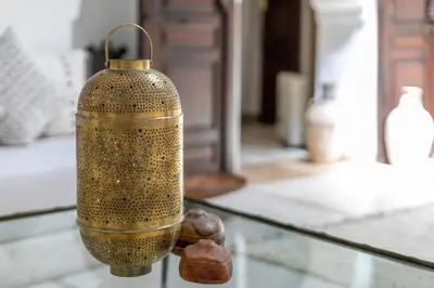 a bottle sitting on top of a glass table at Riad Safar in Marrakech