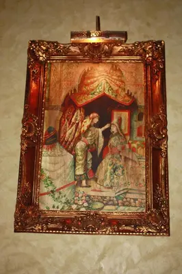 a picture of a painting in a gold frame at Riad Lorsya in Marrakech
