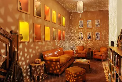 a living room with a couch and chairs and tables at La Villa Nomade in Marrakech
