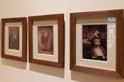 three framed photographs of people are on a wall at La Villa Nomade in Marrakech