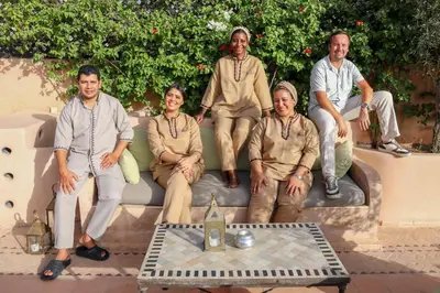 a group of people sitting on a couch at Riad Zayane in Marrakech