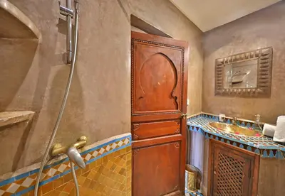 a bathroom with a shower and a sink at Riad Zayane in Marrakech