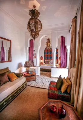 a living room with a couch and a table at Riad Villa Almeria Hotel & Spa in Marrakech