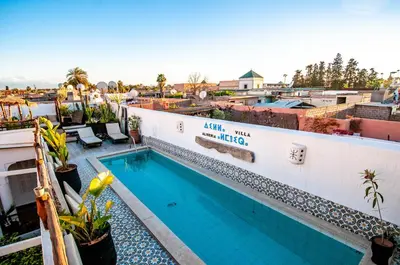 a swimming pool on the roof of a building at Riad Villa Almeria Hotel & Spa in Marrakech