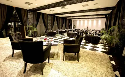 a banquet hall with tables and chairs in a room at Adam Park Marrakech Hotel & Spa in Marrakech